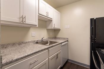 This is a photo of the kitchen in a 849 square foot split 2 bedroom, 2 bath apartment at Park Lane Apartments in Cincinnati, OH.