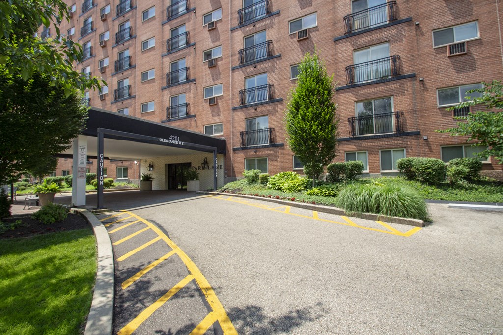 This is a photo of the building exterior showing the entrance to Park Lane Apartments in Cincinnati, OH.