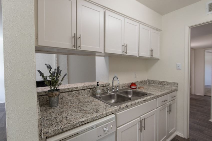 This is a photo of the kitchen in the 970 square foot 2 bedroom, 2 bath apartment at Preston Park Apartments in Dallas, TX - Photo Gallery 1