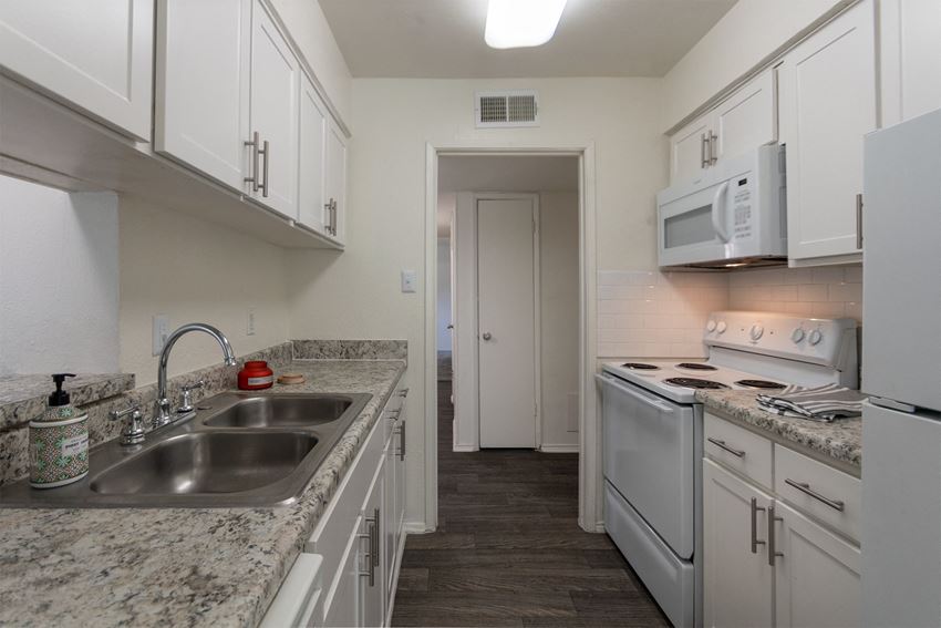 This is a photo of the kitchen room in the 970 square foot 2 bedroom, 2 bath apartment at Preston Park Apartments in Dallas, TX - Photo Gallery