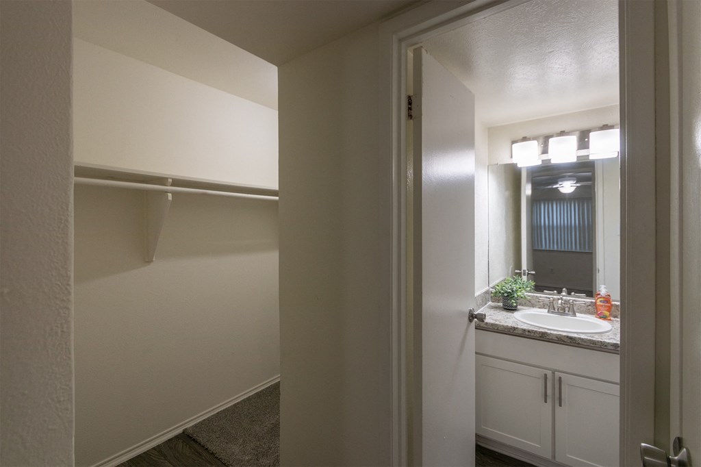 bathroom and walk-in closet at Preston Park Apartments, Dallas, TX