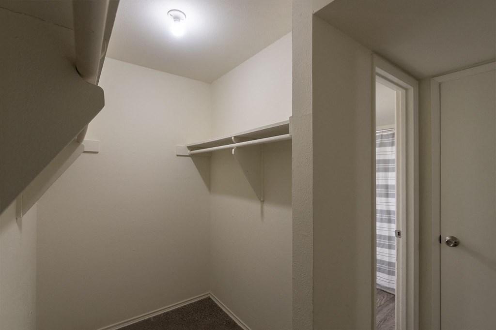 primary bedroom walk-in closet at Preston Park Apartments, Dallas, TX