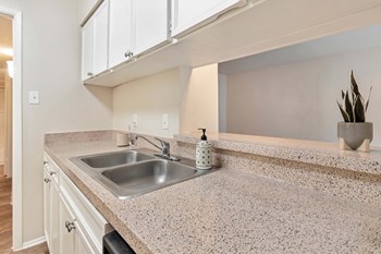 This is a photo of the kitchen in the 650 square foot 1 bedroom, 1 bath apartment at Preston Park Apartments in Dallas, TX - Photo Gallery 4