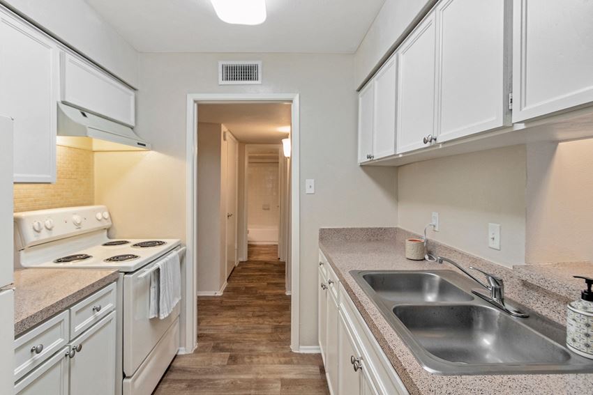 This is a photo of the kitchen in the 650 square foot 1 bedroom, 1 bath apartment at Preston Park Apartments in Dallas, TX - Photo Gallery