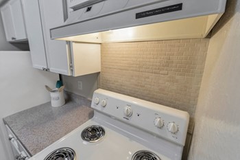 This is a photo of the kitchen in the 650 square foot 1 bedroom, 1 bath apartment at Preston Park Apartments in Dallas, TX - Photo Gallery 5