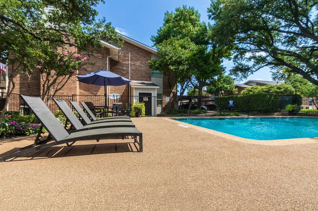 Swimming pool area at Preston Park Apartments, Dallas