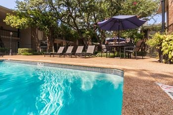 This is a photo of the pool area at Preston Park Apartments in Dallas, TX