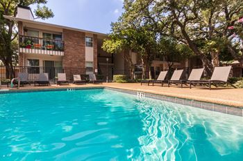 This is a photo of the pool area at Preston Park Apartments in Dallas, TX