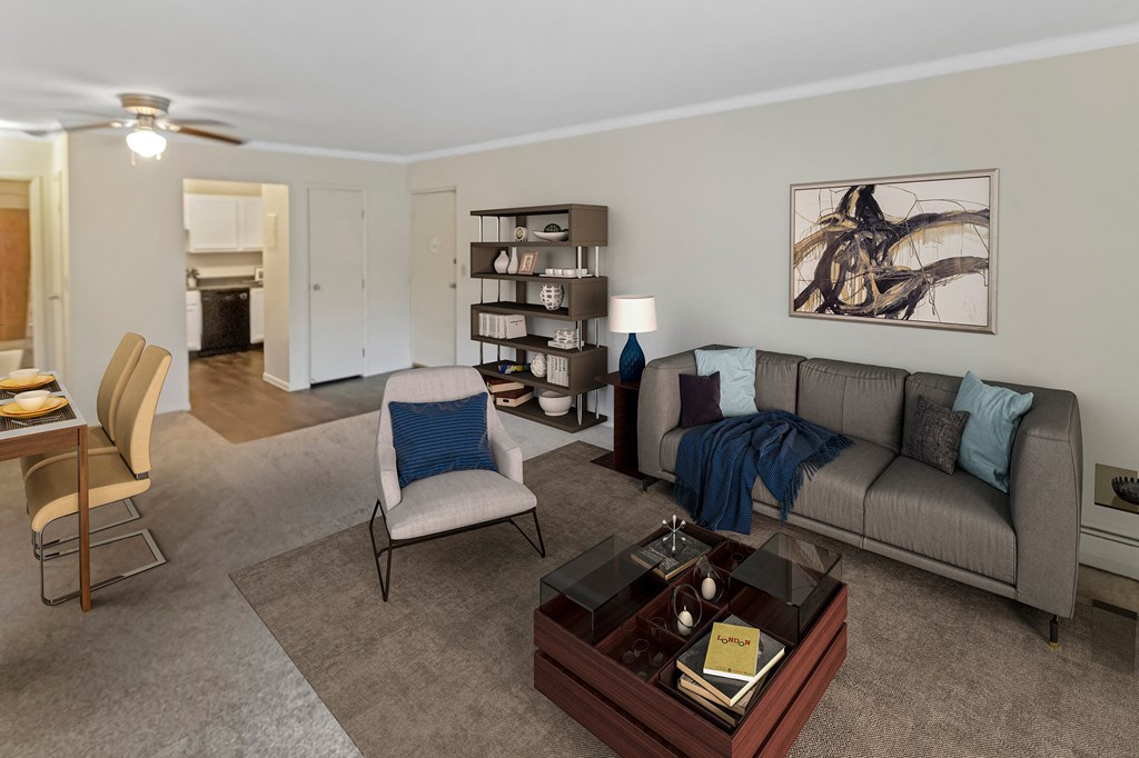This is a photo of the digitally staged living room of a 742 square foot, 2 bedroom apartment at Romaine Court Apartments in Cincinnati, Ohio.