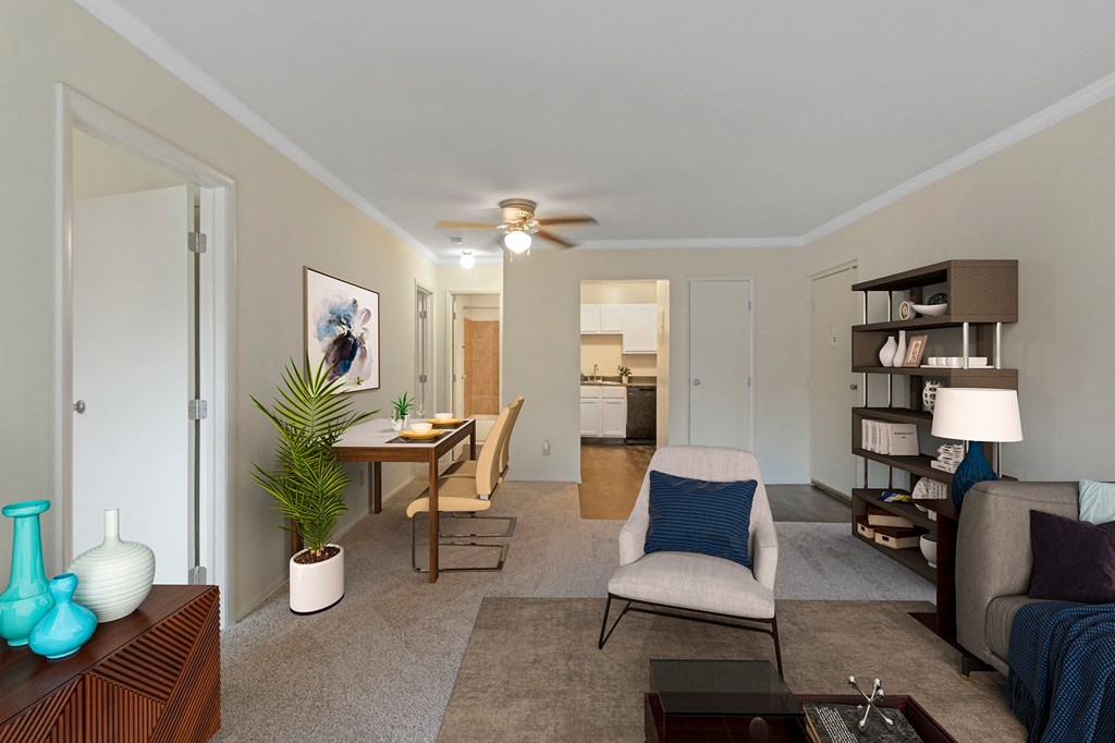 This is a photo of the digitally staged living room of a 742 square foot, 2 bedroom apartment at Romaine Court Apartments in the Oakley neighborhood of Cincinnati, Ohio.