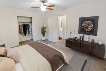 This is a photo of the digitally staged primary bedroom of a 742 square foot, 2 bedroom apartment at Romaine Court Apartments in Cincinnati, Ohio. - Photo Gallery 19