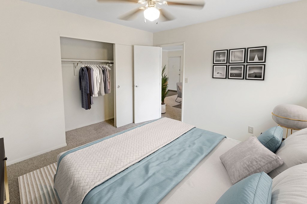 This is a photo of the digitally staged second bedroom of a 742 square foot, 2 bedroom apartment at Romaine Court Apartments in the Oakley neighborhood of Cincinnati, Ohio.