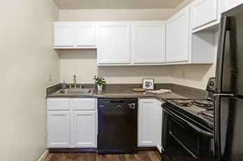 This is a photo of the kitchen of a 742 square foot, 2 bedroom apartment at Romaine Court Apartments in the Oakley neighborhood of Cincinnati, Ohio. - Photo Gallery 2