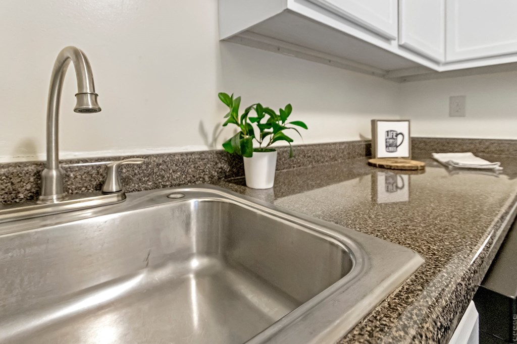 This is a photo of the kitchen of a 742 square foot, 2 bedroom apartment at Romaine Court Apartments in the Oakley neighborhood of Cincinnati, Ohio.
