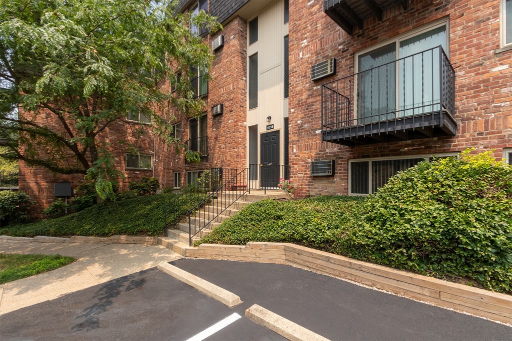 This is a photo of a building exterior at Romaine Court Apartments in the Oakley neighborhood of Cincinnati, Ohio.