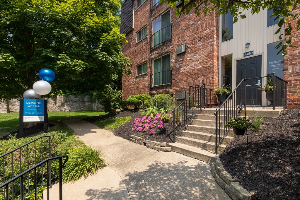 This is a photo of the building entrance to the leasing office at Romaine Court Apartments in the Oakley neighborhood of Cincinnati, Ohio.