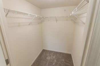 This is photo of the second bedroom walk-in closet in the 1056 square foot, 2 bedroom Gainsway floor plan at Trails of Saddlebrook Apartments in Florence, KY.