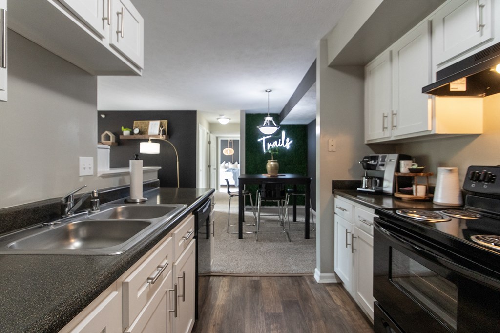 This is a photo of the dining room from the  kitchen in the 1226 square foot 3 bedroom, 2 bath Hambletonian at Trails of Saddlebrook Apartments in Florence, KY.