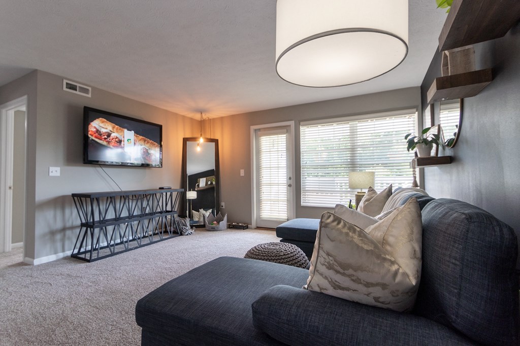 This is a photo of the living room in the 1226 square foot 3 bedroom, 2 bath Hambletonian at Trails of Saddlebrook Apartments in Florence, KY.