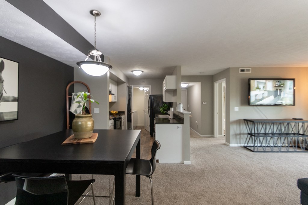 This is a photo of the kitchen and living room from the dining room in the 1226 square foot 3 bedroom, 2 bath Hambletonian at Trails of Saddlebrook Apartments in Florence, KY.