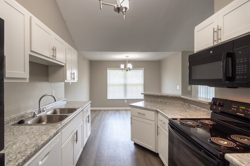This is photo of the dining area from the kitchen in the 852 square foot, 1 bedroom, 1 bath Fairlawn floor plan at Trails of Saddlebrook Apartments in Florence, KY.