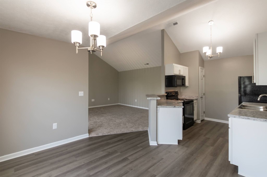 This is photo of the dining area and kitchen in the 852 square foot, 1 bedroom, 1 bath Fairlawn floor plan at Trails of Saddlebrook Apartments in Florence, KY.