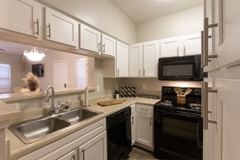 This is a photo of the kitchen in the 1135 square foot 2 bedroom Retreat floor plan at The Sanctuary at Fishers Apartments in Fishers, IN. - Photo Gallery 2