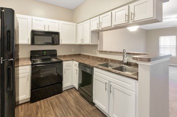 This is a photo of the kitchen in the 1110 square foot, lower 2 bedroom Serenity floor plan at The Sanctuary at Fishers Apartments in Fishers, IN. - Photo Gallery 3