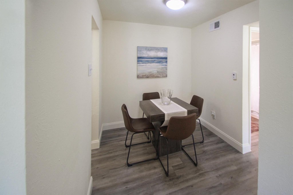 This is a photo of the dining room in the 558 square foot 1 bedroom, 1 bath model apartment at The Summit at Midtown Apartments in Dallas, TX.