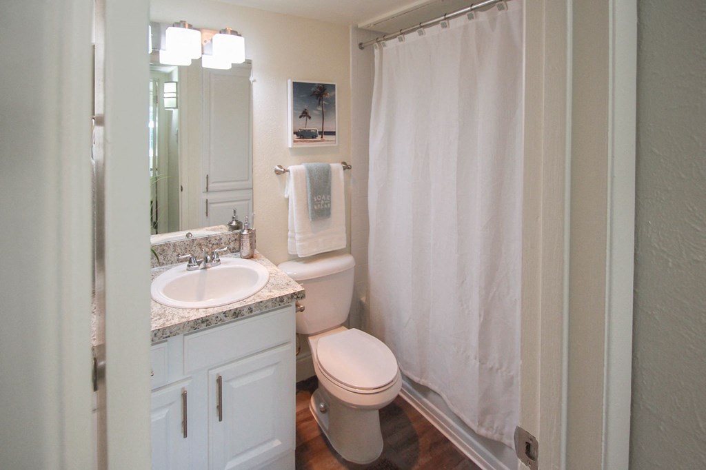 This is a photo of the bathroom in the 558 square foot 1 bedroom, 1 bath model apartment at The Summit at Midtown Apartments in Dallas, TX.