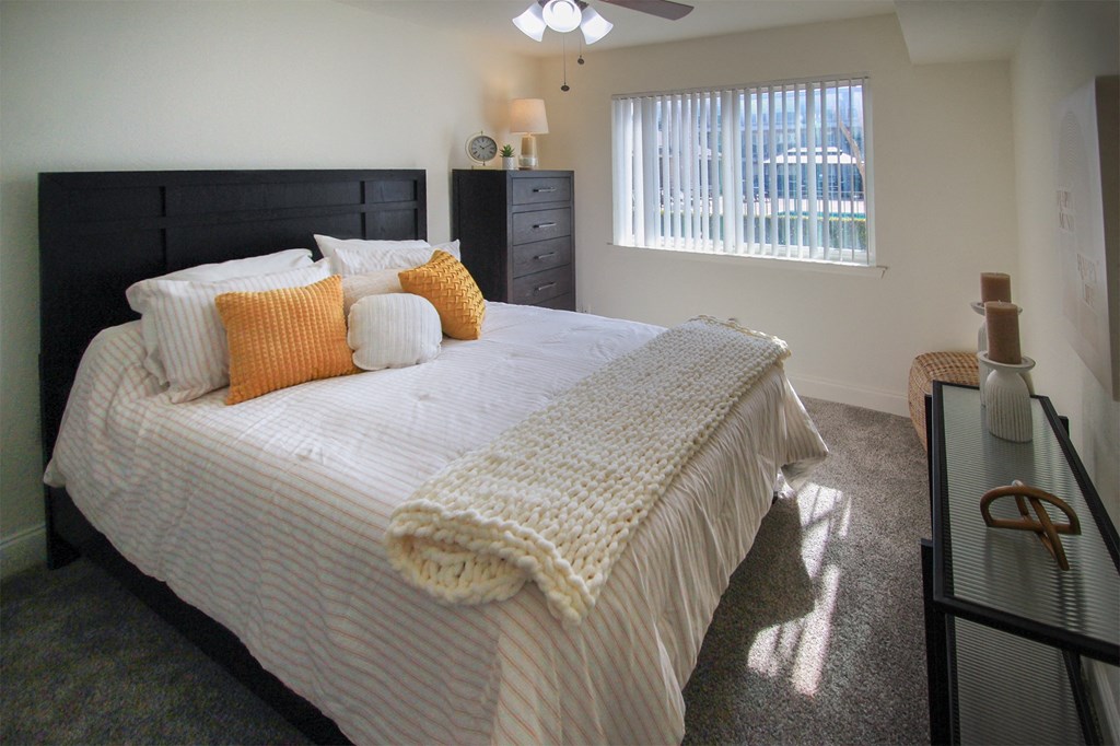 This is a photo of the bedroom in the 558 square foot 1 bedroom, 1 bath model apartment at The Summit at Midtown Apartments in Dallas, TX.