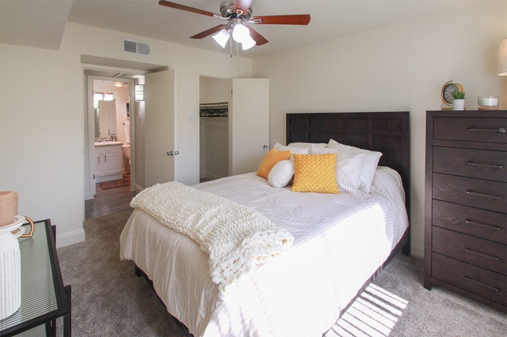 This is a photo of the bedroom in the 558 square foot 1 bedroom, 1 bath model apartment at The Summit at Midtown Apartments in Dallas, TX.