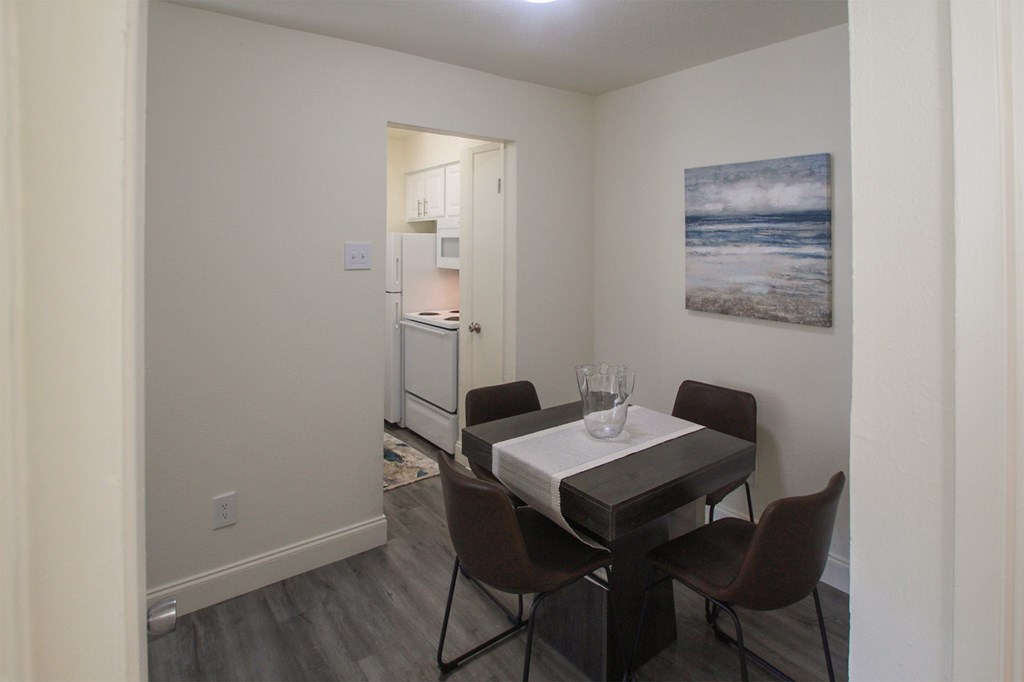This is a photo of the dining room in the 558 square foot 1 bedroom, 1 bath model apartment at The Summit at Midtown Apartments in Dallas, TX.