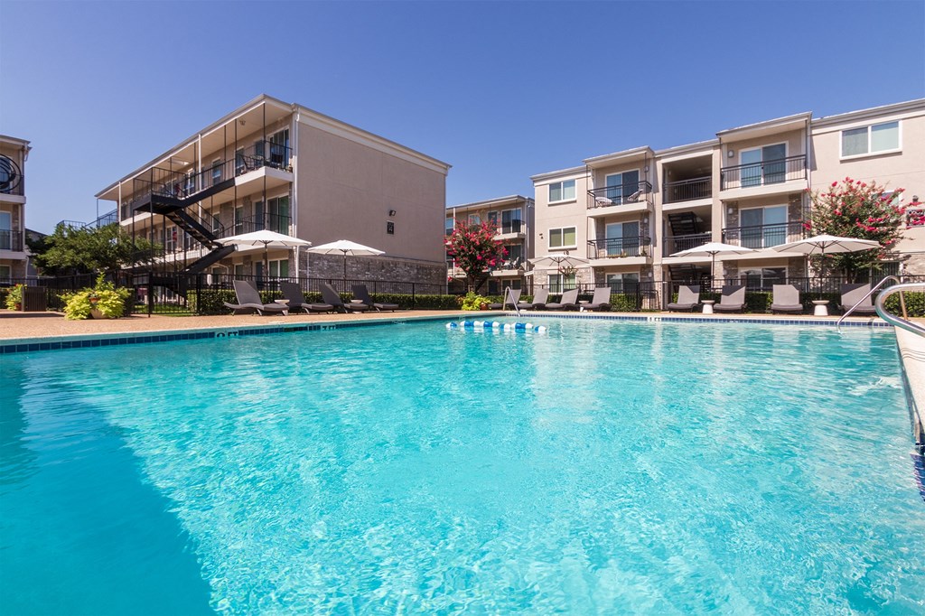 This is a photo of the pool area at The Summit at Midtown Apartments in Dallas, TX.
