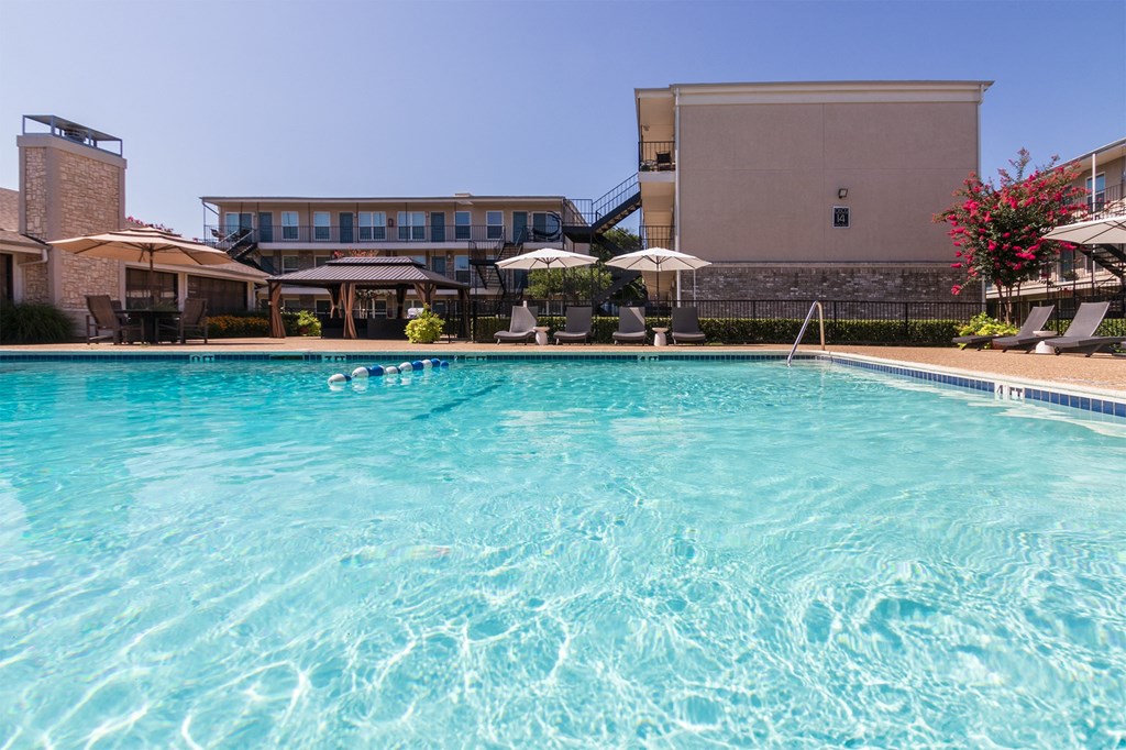 This is a photo of the pool area at The Summit at Midtown Apartments in Dallas, TX.