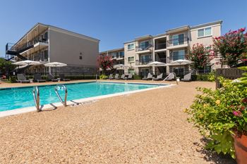 This is a photo of the pool area at The Summit at Midtown Apartments in Dallas, TX.