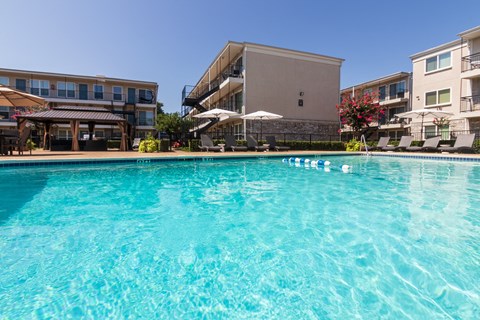 This is a photo of the pool area at The Summit at Midtown Apartments in Dallas, TX.