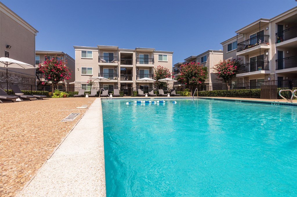 This is a photo of the pool area at The Summit at Midtown Apartments in Dallas, TX.