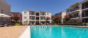 This is a photo of the pool area at The Summit at Midtown Apartments in Dallas, TX.