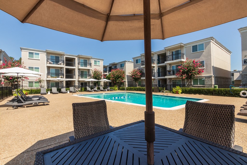 This is a photo of the pool area at The Summit at Midtown Apartments in Dallas, TX.