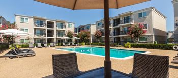This is a photo of the pool area at The Summit at Midtown Apartments in Dallas, TX.