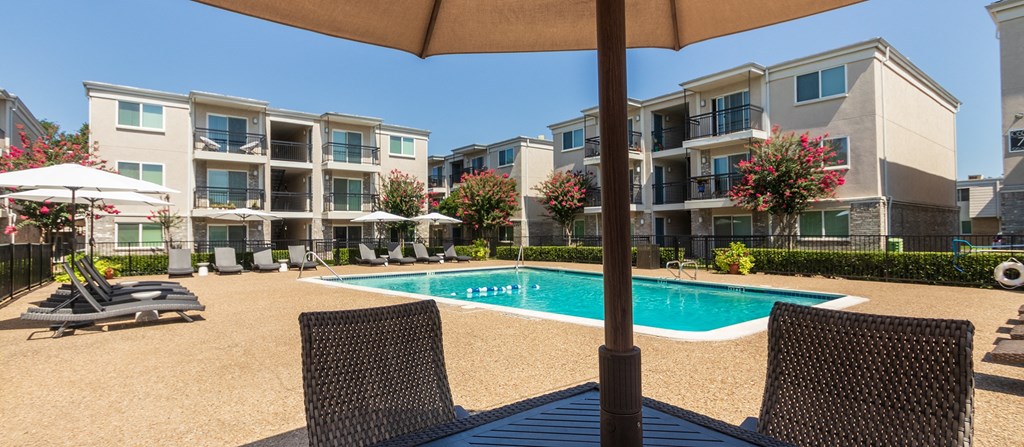 This is a photo of the pool area at The Summit at Midtown Apartments in Dallas, TX.