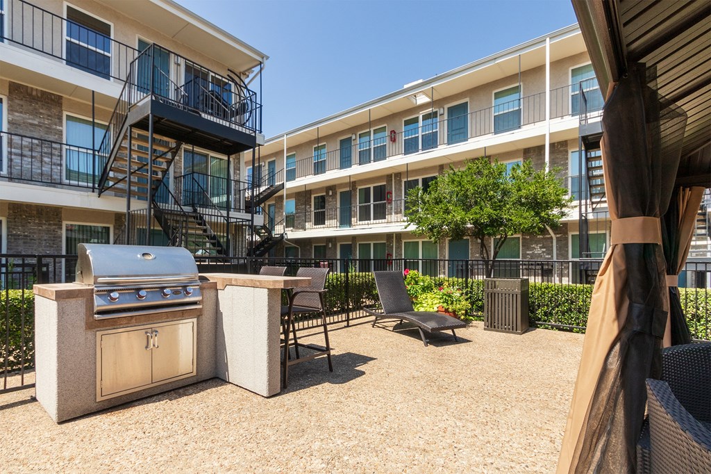 This is a photo of the grilling station in the pool area at The Summit at Midtown Apartments in Dallas, TX.