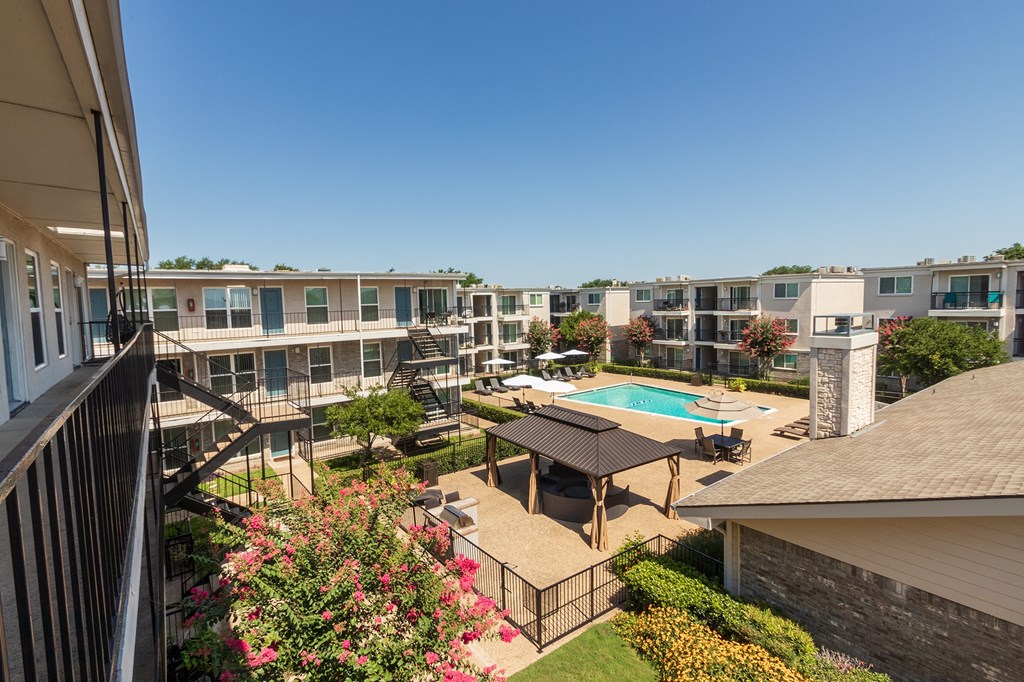 This is a photo of the pool area at The Summit at Midtown Apartments in Dallas, TX.
