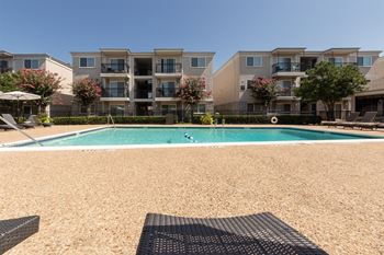 This is a photo of the pool area at The Summit at Midtown Apartments in Dallas, TX.