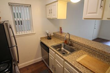 This is a photo of the breakfast bar of a 558 square foot 1 bedroom apartment at The Summit at Midtown Apartments in Dallas, TX.