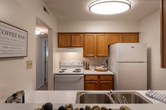 This is a photo of the kitchen in the 822 square foot, 2 bedroom, 1 bath floor plan at Village East Apartments in Franklin, OH.