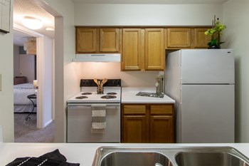 This is a photo of the kitchen in the 822 square foot, 2 bedroom floor plan at Village East Apartments in Franklin, OH. - Photo Gallery 3