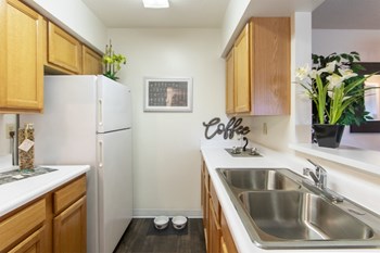 This is a photo of the kitchen in the 822 square foot, 2 bedroom floor plan at Village East Apartments in Franklin, OH. - Photo Gallery 2