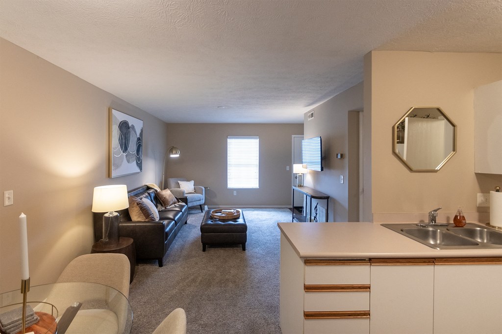 This is a photo of the living room from the dining room  of the 890 square foot 2 bedroom, 2 bath Liberty at Washington Place Apartments in in Miamisburg, Ohio in Washington Township.